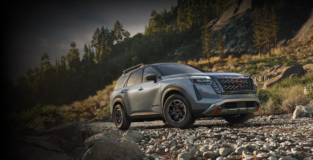 A gray 2026 Nissan Pathfinder parked on a rocky path